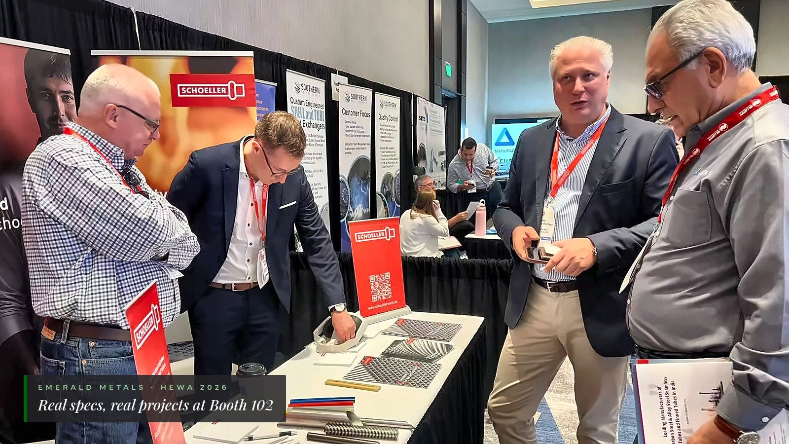 Emerald Metals and Schoeller Werk representatives discussing stainless steel tubing at Heat Exchanger World Americas 2026, Booth 102.